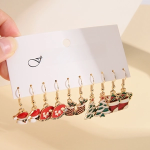 Detail of Christmas earring set with Santa and reindeer motifs on display card