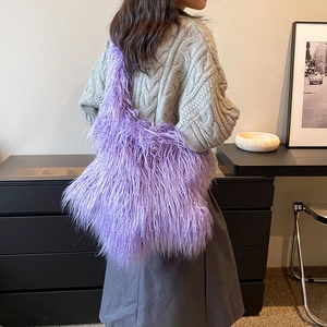 Fashionable purple faux fur shoulder bag worn by a model in a modern interior setting