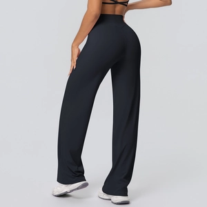 Detail view of high waist wide waistband on elastic black straight yoga pants