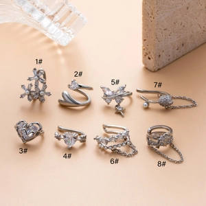 Collection of silver-tone zircon butterfly and pearl ear bone clips in eight unique designs