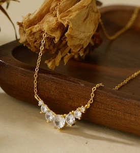 Macro shot of S925 sterling silver smile necklace with seven gradient cubic zirconia stones