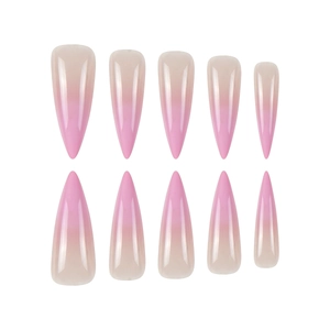 Glossy stiletto press-on nails featuring a soft nude to pink ombre gradient finish