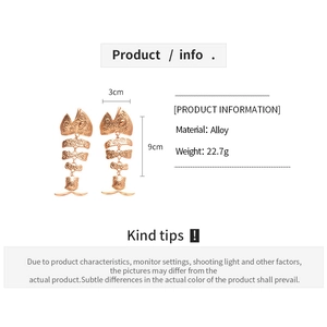 Detailed size chart for rose gold fishbone drop earrings measuring 9cm by 3cm
