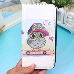 Close-up of owl cartoon print and neat stitching on long white PU leather wallet