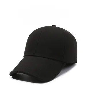 Close-up of black winter baseball cap featuring silver DARESIO logo and thick warm fabric