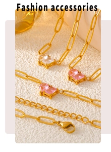 Detail of 18k gold plated chain with pink and clear square zircon pendant charms