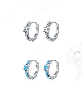 Detailed close-up of S925 sterling silver earrings with turquoise and white zircon stones