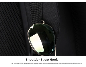 Detail of backpack shoulder strap hook showing sunglasses hanging for easy access