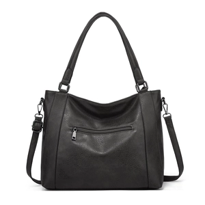 Close-up of black retro tote bag with lychee grain texture and gun-grey metal zipper