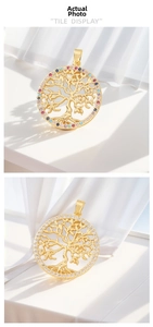 Close-up of tree of life pendants with colorful and white cubic zirconia stones