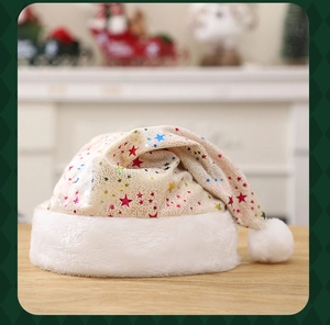 Detail of soft Christmas hat with shiny colorful stars on high quality fabric texture