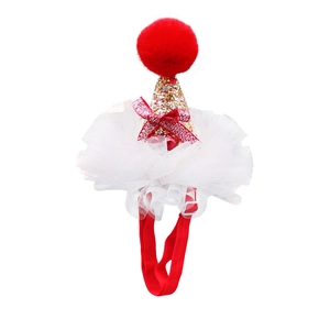 Close-up of festive pet hat featuring gold sequins, red glitter bow, and lace mesh trim