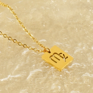 Polished gold hollow rectangle pendant necklace featuring Virgo zodiac sign engraving