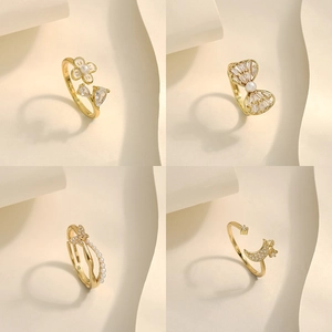 Adjustable gold plated rings set with pearls and zircons in floral and bow designs