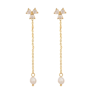 Detail of elegant gold tassel earrings with zircon flower studs and natural freshwater pearls
