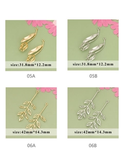 Detailed view of tulip and leaf pendants in gold and silver for DIY jewelry making