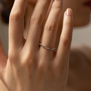 Minimalist S925 sterling silver bamboo knot ring with irregular twig texture on finger