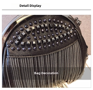 Close-up of black leather bag featuring stud rivets and dense silver metal tassel fringe