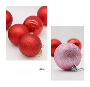 Macro detail of red and pink PET Christmas balls in glossy, matte, and glitter finishes