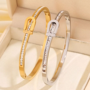 Luxe titanium steel LOVE engraved bangle with pavé diamonds in gold and silver finish