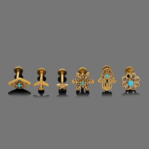 Detailed set of six golden stainless steel piercings with vintage turquoise inlays