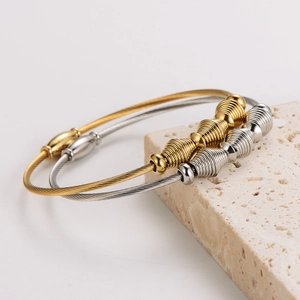 Minimalist magnetic wire cable bracelets in gold and silver finish with spiral beads