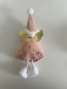 Detail of pink knitted angel ornament with golden wings and white faux fur trim decor