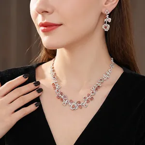 Vintage zircon rose jewelry set featuring a red gemstone necklace and dangle earrings