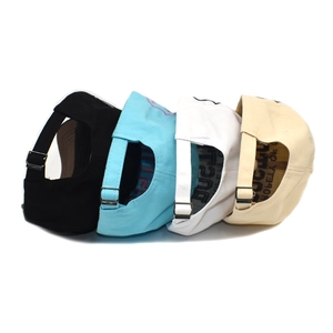 Detail view of cotton baseball caps showing adjustable metal buckles in four colors