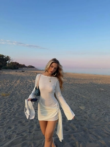 White long sleeve knitted dress with side ties and floral details for beach vacation style