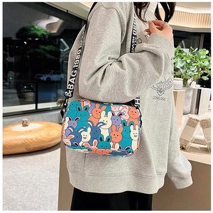 Detail of cartoon rabbit print crossbody bag with BAG.1980 lettered shoulder strap