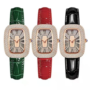 Elegant women's emerald green watch with sparkling rhinestone bezel and leather strap