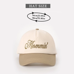 Close-up of Mommin' embroidery on two-tone baseball cap with head size guide 56-58cm