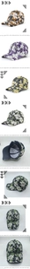 Detail view of floral print baseball caps showing various colors and curved brim design