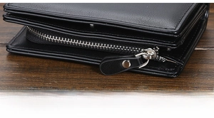 Close-up of black leather wallet featuring a durable metal zipper and leather puller