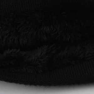Close-up of thick black fleece lining and knit texture on winter thermal beanie hat