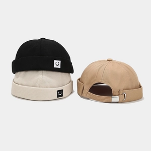 Unisex docker hats in black, white, and khaki with square smiley face embroidery