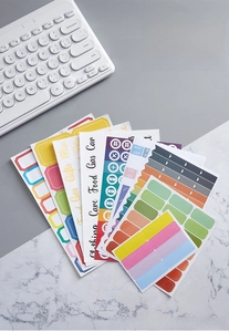 Detail view of colorful self-adhesive category labels for planners and organizing