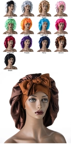 Macro detail of wide-brim satin sleep bonnets with silk texture and bow decoration