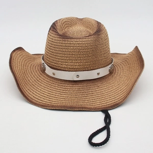 Detail of woven straw cowboy hat with white leather band and silver studs on neutral background