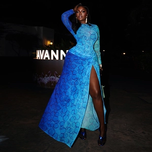 Detail of blue gradient printed midi dress with side slit and sheer mesh texture