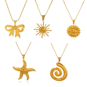 Golden starfish and sunflower pendant necklaces set featuring butterfly and spiral charms