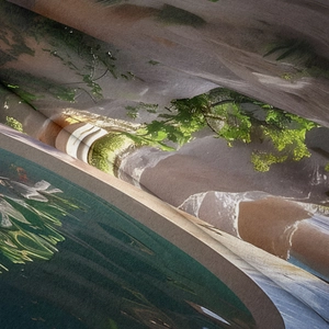 Close-up of soft twill landscape tapestry fabric showing detailed green trees and lake print