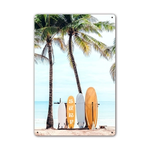 Vintage metal surf sign featuring retro beach scenery and palm trees for wall decoration