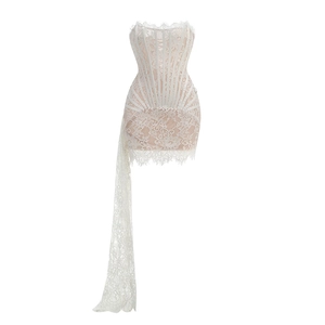 Close-up of white lace corset dress with boning details and asymmetric floral fringe