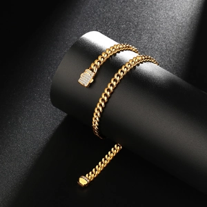 Men's gold-plated Cuban link chain necklace with sparkling diamond-encrusted square clasp