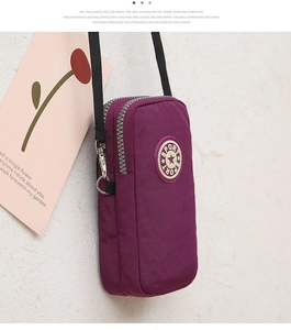Detail of purple nylon phone crossbody bag with multi-layer zippers and SPORT logo