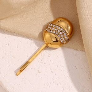 Detail of 18K gold-plated hair clip with triple rows of white crystal pavé setting