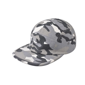 Detail of 5-panel flat brim cap featuring grey camouflage cotton and metal eyelets