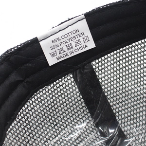 Detail view of the baseball cap's wash label showing 65% cotton and 35% polyester mix